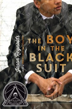 The boy in the black suit