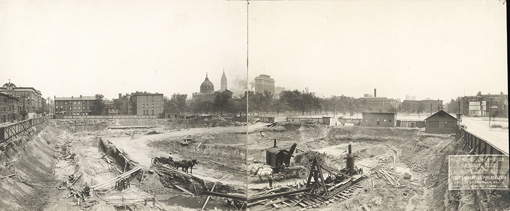 Excavation of the site of the Central Library of the Free Library of Philadelphia with steam shovel and horse carts, June 1, 1918