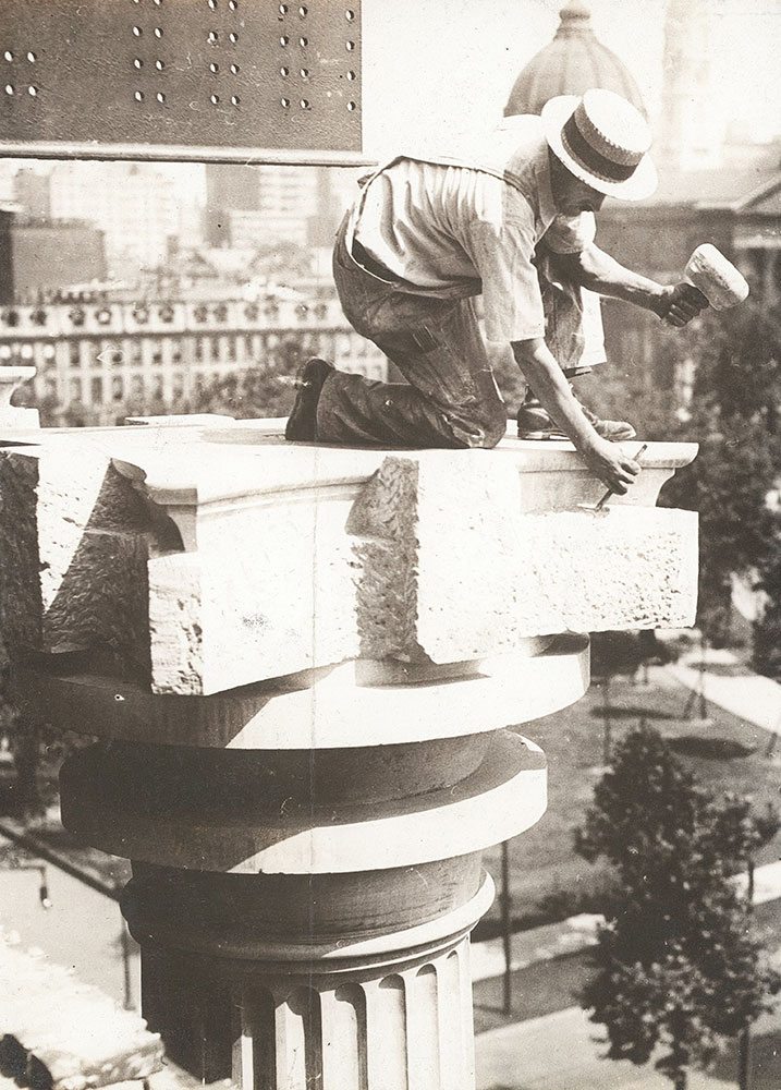 Stone carver from the John Donnelly Company beginning a Corinthian capital at the Central Library of the Free Library of Philadelphia, ca. 1924-1925
