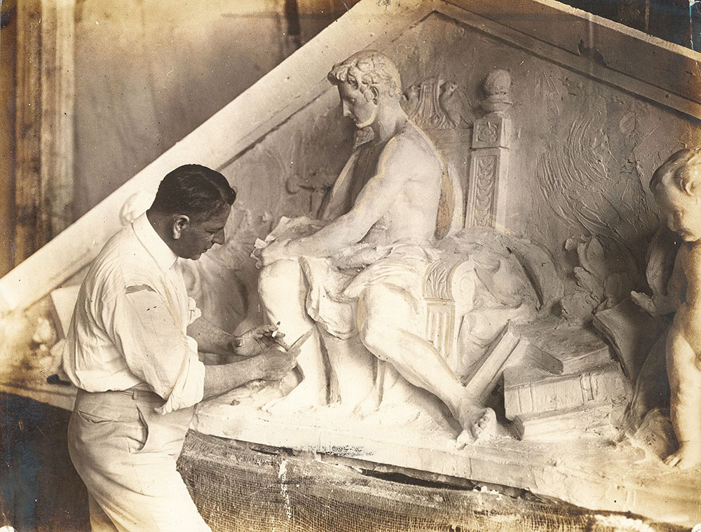 Sculptor working on the model for the west pediment sculptural group of the Central Library of the Free Library of Philadelphia, 1925