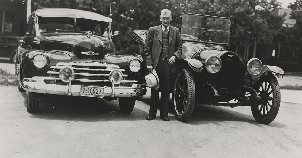 Chevrolet - 1913 - with 1947 Chevrolet on right and Mr. J.M. Pike, Chevrolet dealer in Boulder, CO