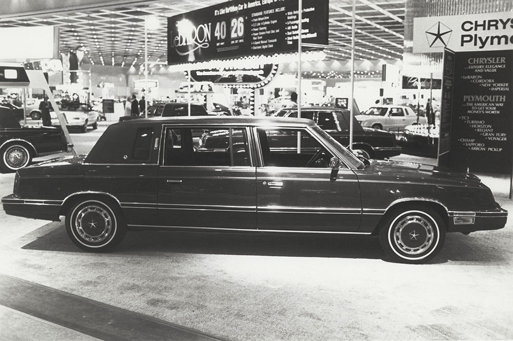 Chrysler - Plymouth car in showroom. 1982