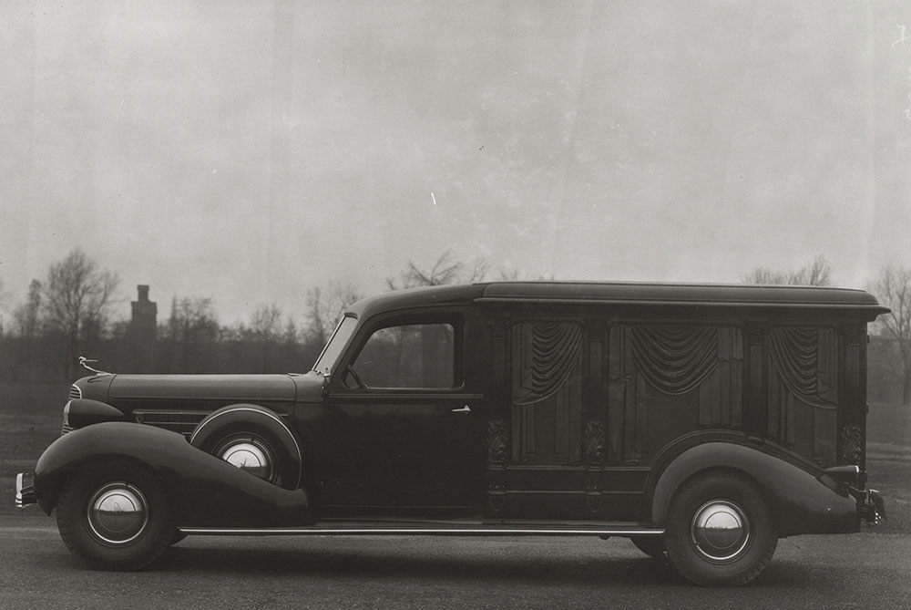 Cunningham hearse on Oldsmobile chassis, carved wood, 8 columns.