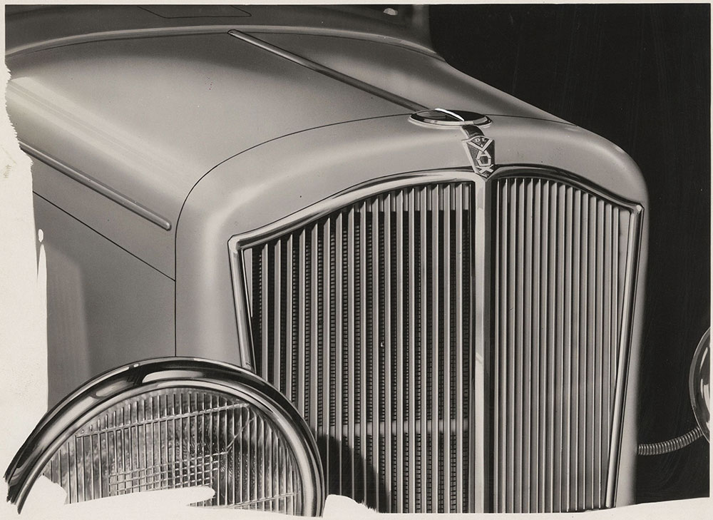De Vaux, 1931. This photo will show you the correct shape of the ribs on radiator front, also the approximate ridge on top of radiator cap.