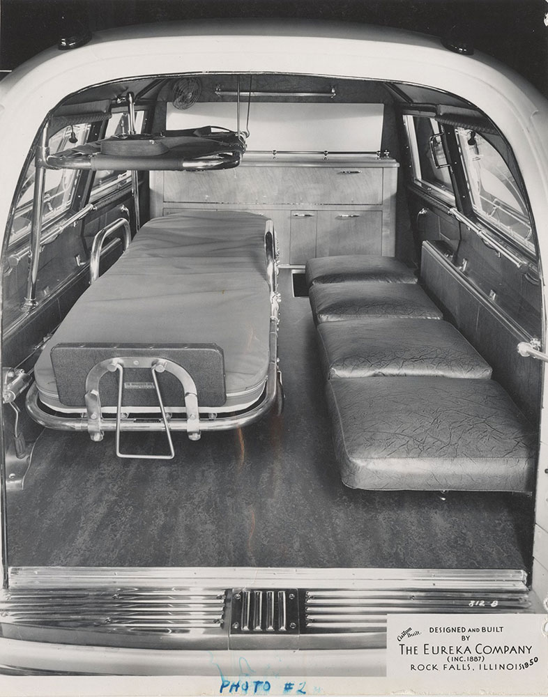 Eureka Company, rear compartment of ambulance, showing gurney: 1950