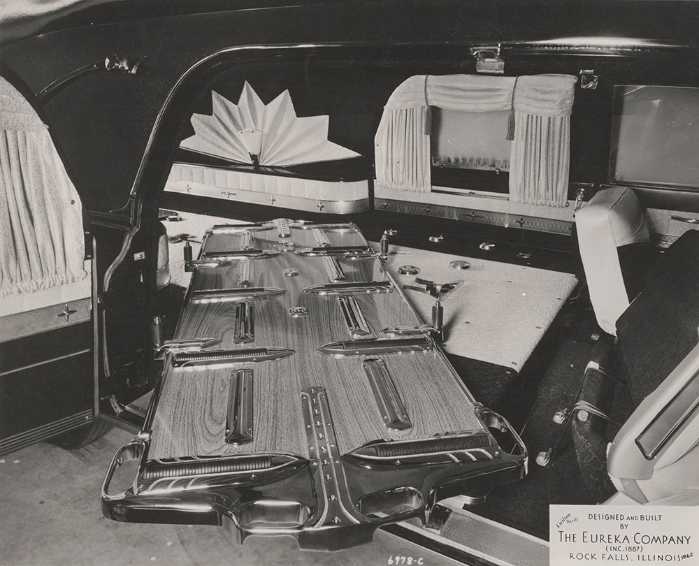 Eureka Company, showing three-way table fitted in funeral car:  1962