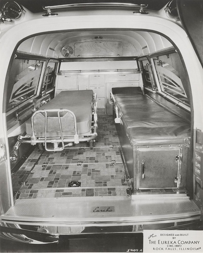 Eureka Company, ambulance, rear compartment, showing gurney:  1959
