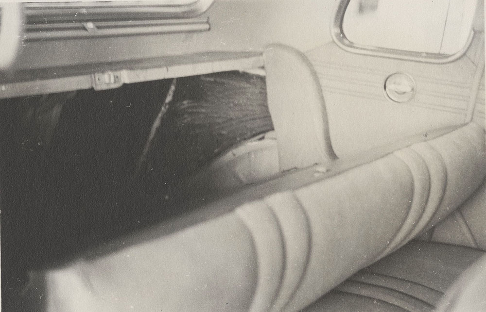 Ford V-8, interior, with rear seat folded forward, showing access to trunk -1935