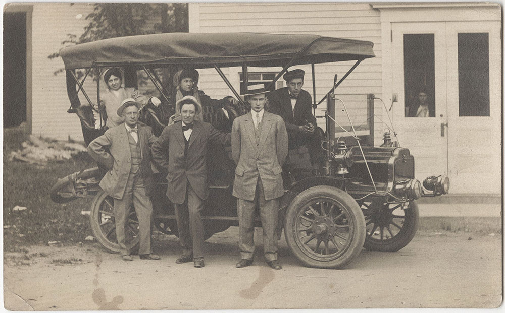Four Men and Two Women in a Car