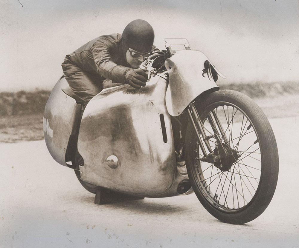 Eric Fernihough with streamlined motorcycle at Brooklands, England 1938