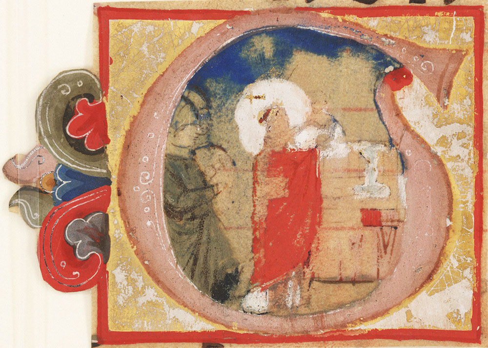 [Initial G with a priest celebrating the Eucharist]