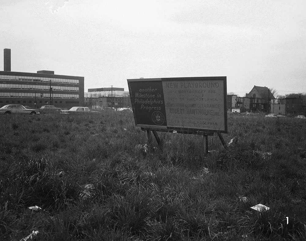 10th & Columbia Ave., Grass Lot with Playground Sign