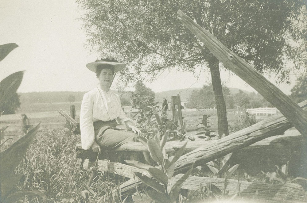 Woman Sitting on Rails