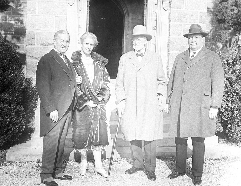 Three men and woman standing outdoors