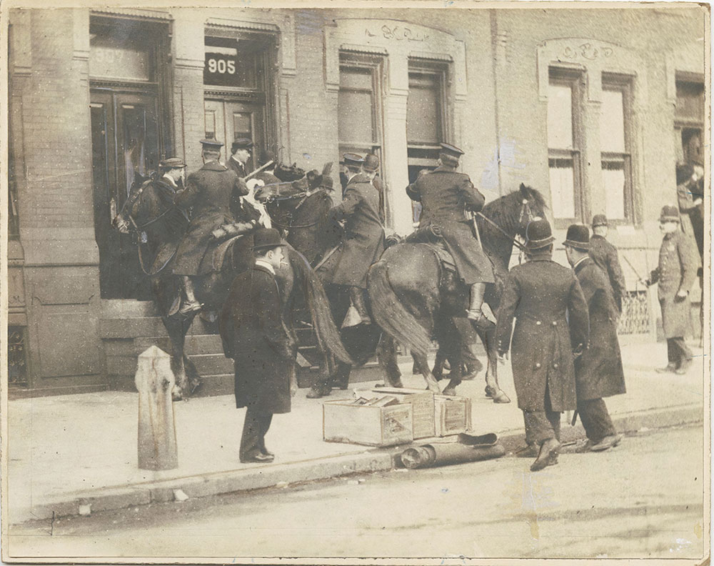 Mounted Police chasing demonstrator up stoop