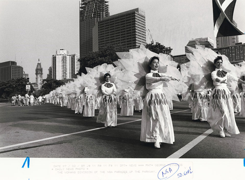 The women's division of the NSA (Nichiren Shoshu Soka Bokkai of America) Buddhist chorus parade down the Ben Franklin Parkway