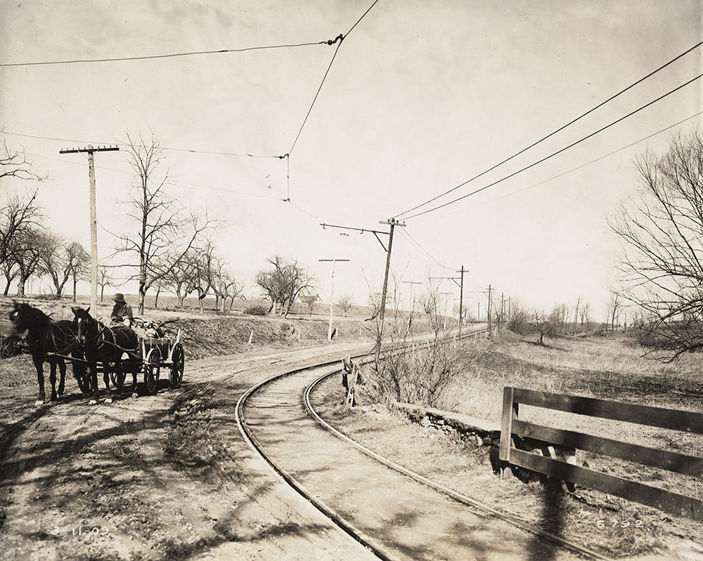 Horses and cart on trolley tracks