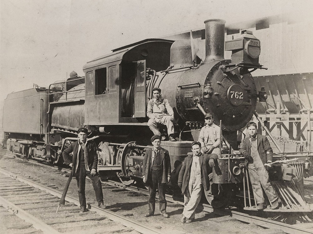Steam train and workers